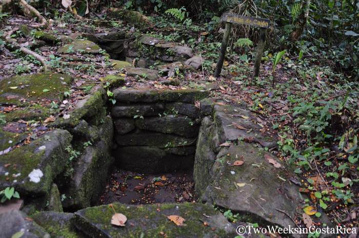An empty stone tomb in the ground at Guayabo National Monument in Costa Rica