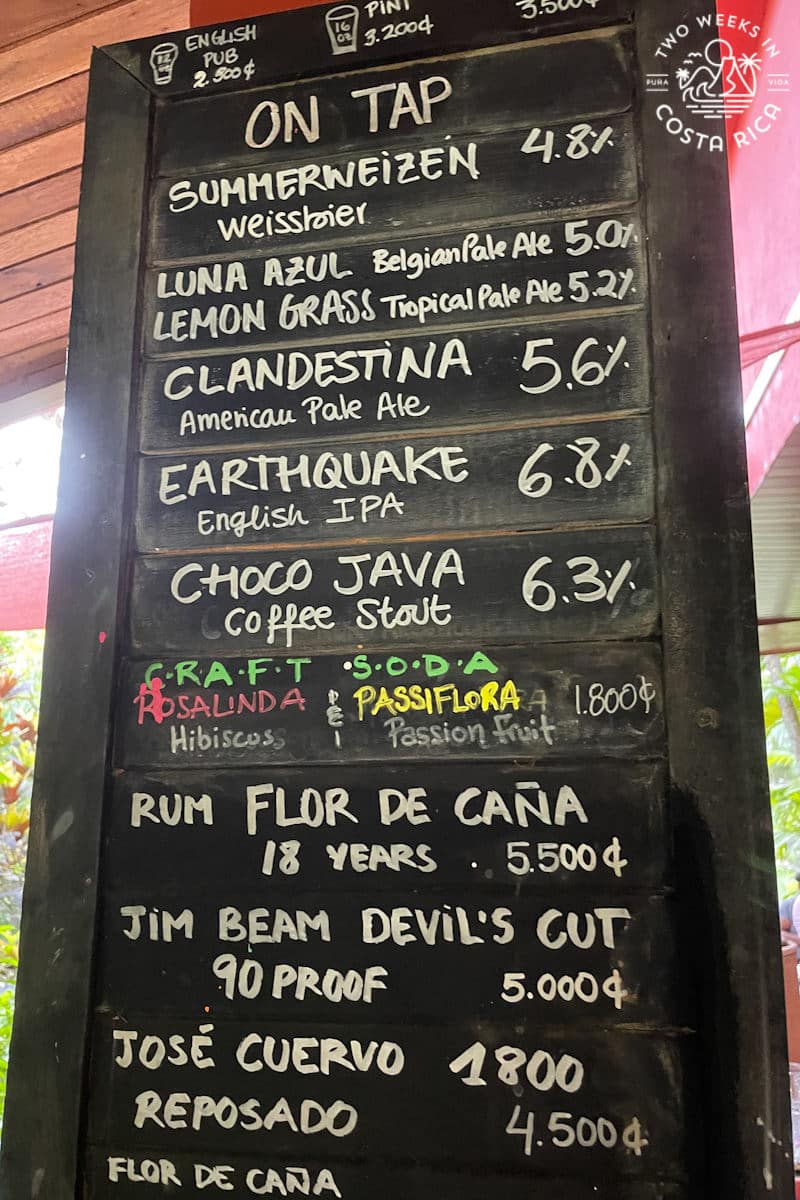 Chalkboard menu listing several craft beers and specialty drinks