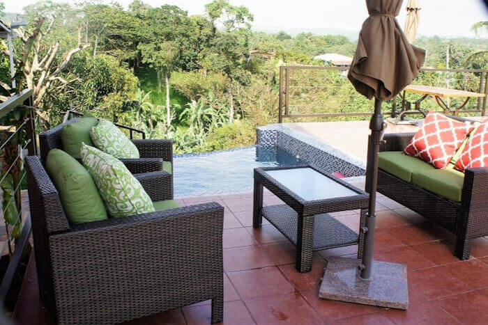 An outdoor sitting area with a small pool