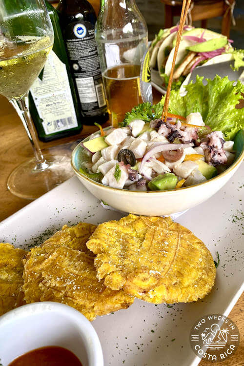 cured fish in a bowl and with patacones