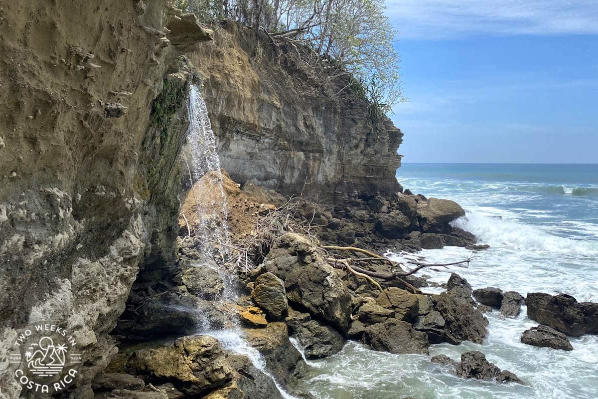 el chorro waterfall flowing into the ocean