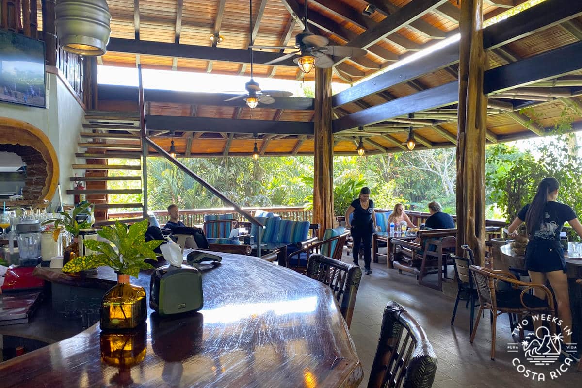 View inside an open-air restaurant that is largely made of wood