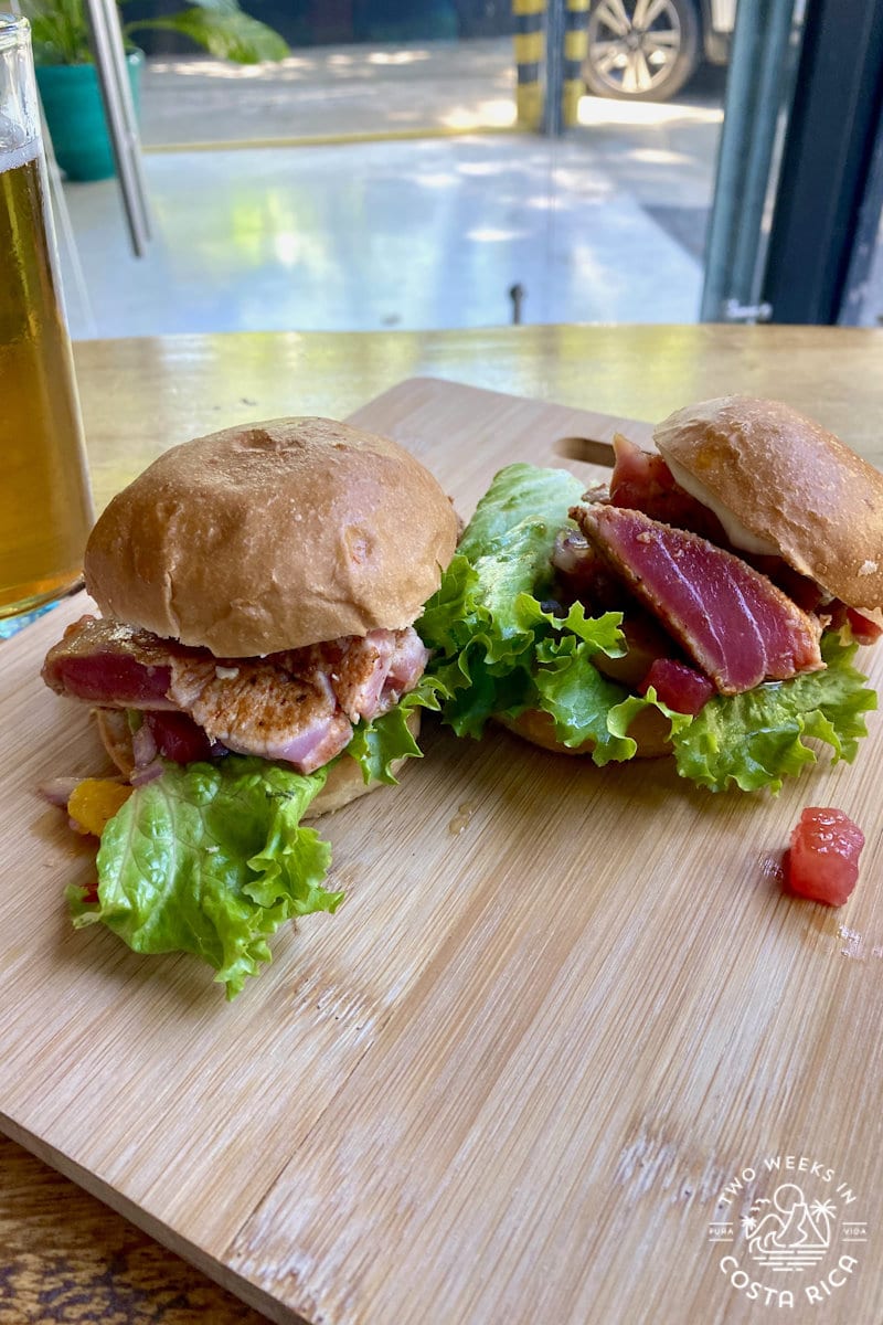 mini tuna burgers on a wooden cutting board