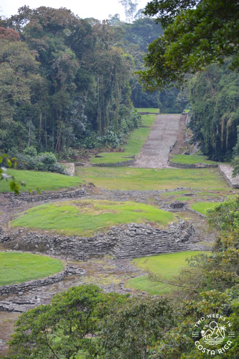 View of circular rock formations and a stone road at Guayabo National Monument