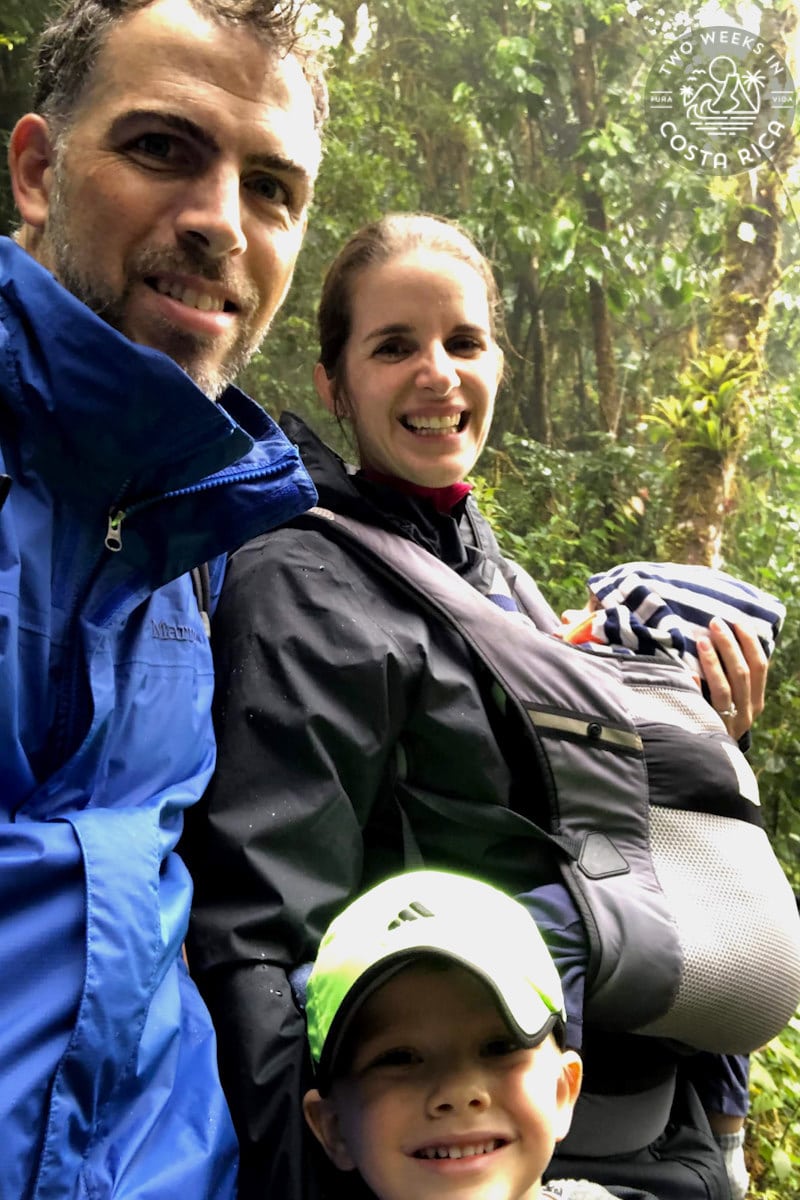 a family hiking with a baby in a carrier