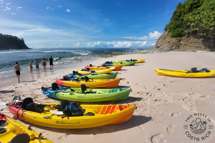Kayaks lined up on beach for an isla chora tour