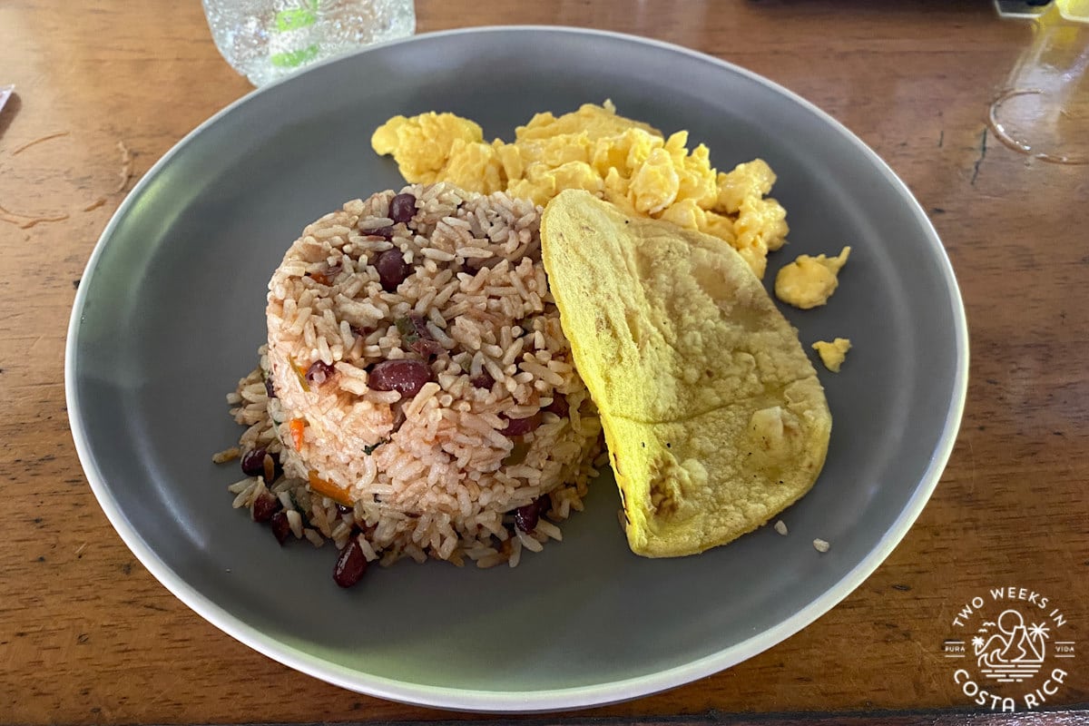 a plate of rice and beans with cheese