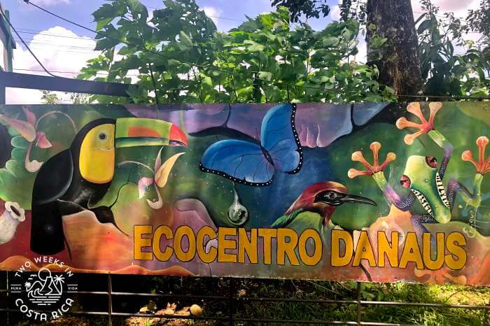 Colorful sign with wildlife and the words Ecocentro Danaus