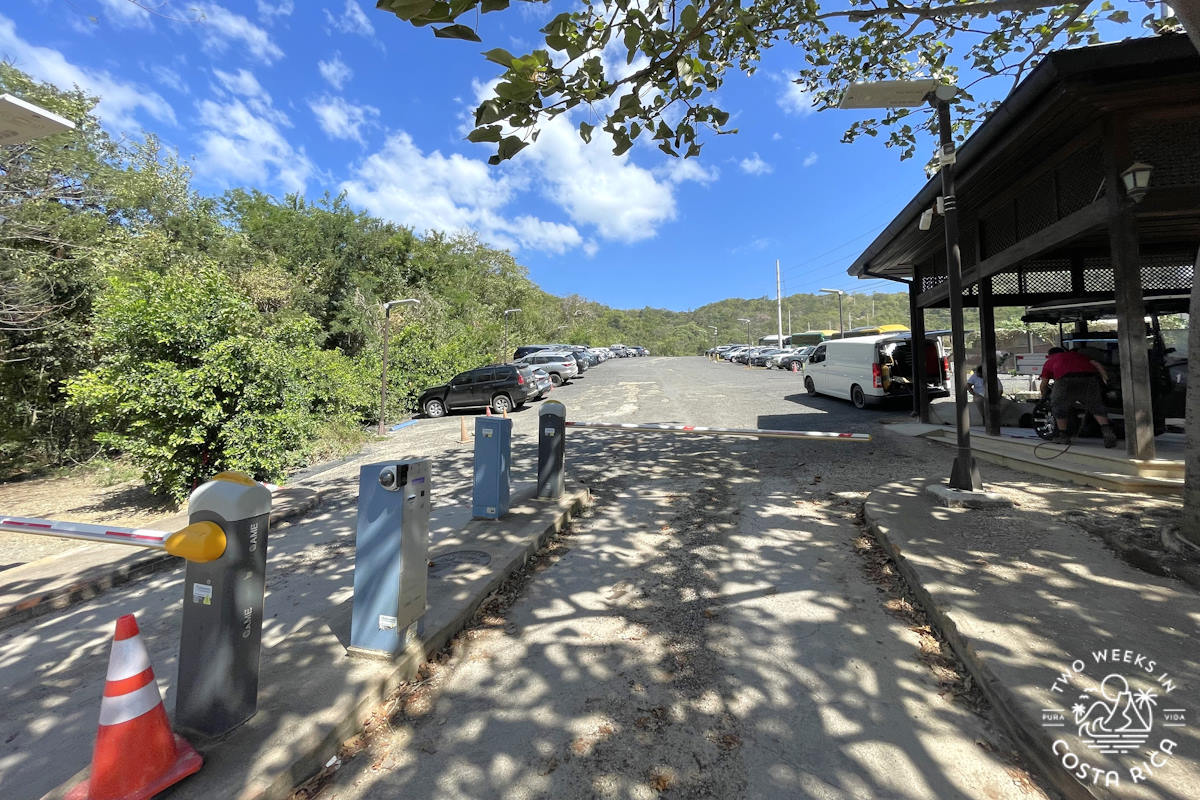 a concrete parking lot with gate at las catalinas costa rica