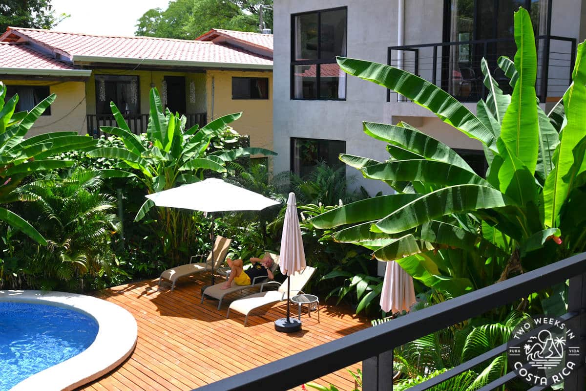 a small hotel with a pool in the central courtyard