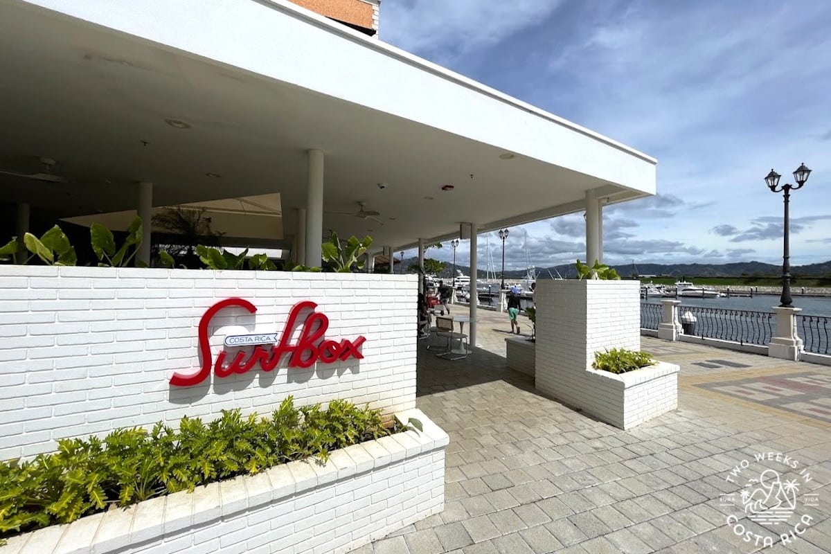 white building with sign at the entrance that reads Surfbox