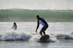 man riding a wave on a surfboard