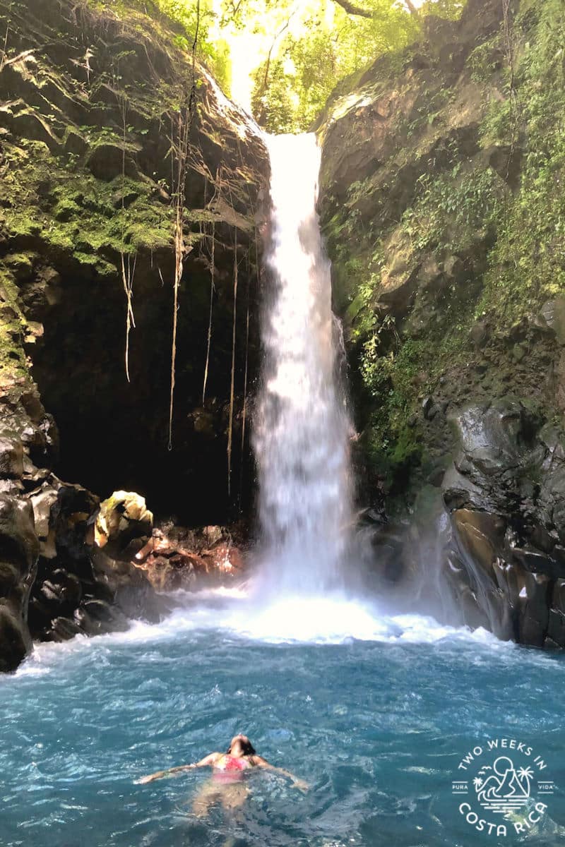 a woman swimming at oropendola waterfall in guanacaste costa rica