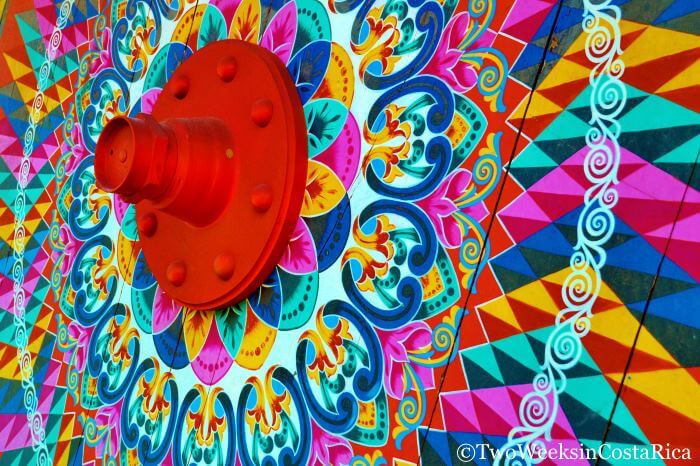 An oxcart wheel in the town of Sarchi, Costa Rica, painted with bright colors and geometric designs