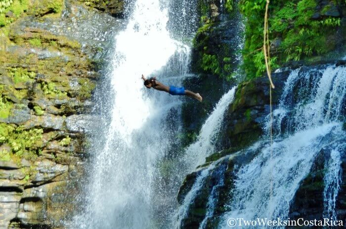A man diving into the Nauyaca Waterfalls near Dominical Costa Rica