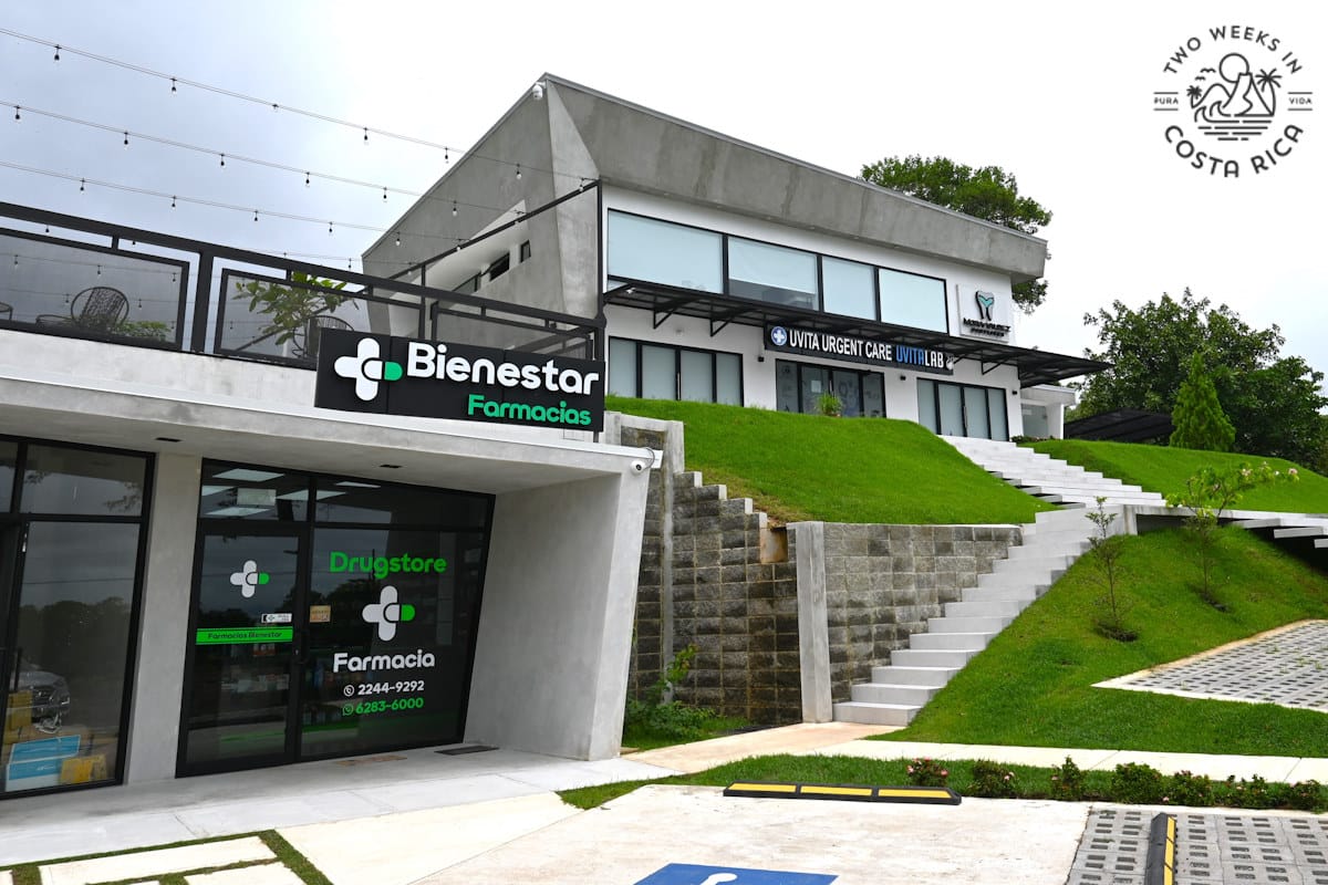 a commercial building with signs that read urgent care and pharmacy